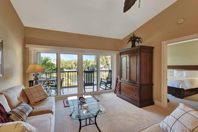 212 Cypress Point Dr, Palm Beach Gardens, FL 33418 - living area featuring light colored carpet, vaulted ceiling, a ceiling fan, and baseboards