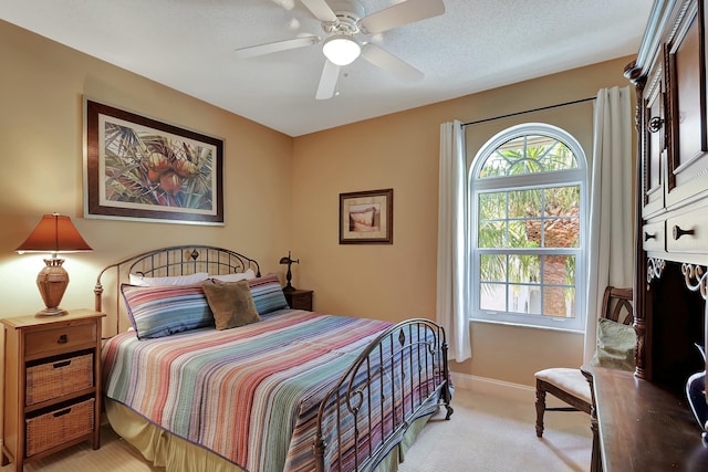 212 Cypress Point Dr, Palm Beach Gardens, FL 33418 - bedroom with light carpet, baseboards, and ceiling fan