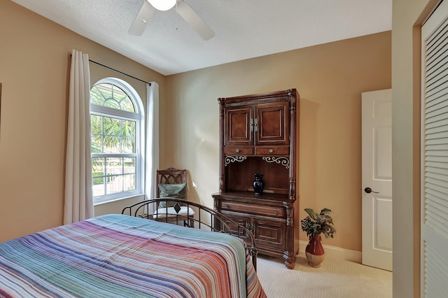 212 Cypress Point Dr, Palm Beach Gardens, FL 33418 - carpeted bedroom featuring ceiling fan and baseboards