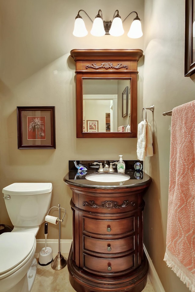212 Cypress Point Dr, Palm Beach Gardens, FL 33418 - bathroom featuring baseboards, toilet, and vanity