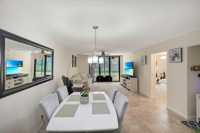 2070 Homewood Blvd Unit 1115, Delray Beach, FL 33445 - dining space with a textured ceiling and baseboards