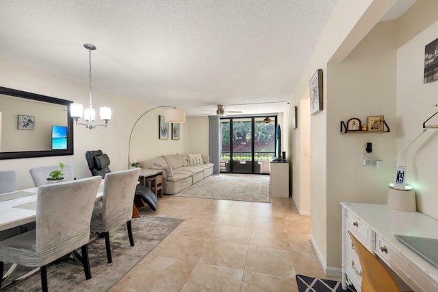 2070 Homewood Blvd Unit 1115, Delray Beach, FL 33445 - dining room with a chandelier, a ceiling fan, a textured ceiling, light tile patterned flooring, and baseboards