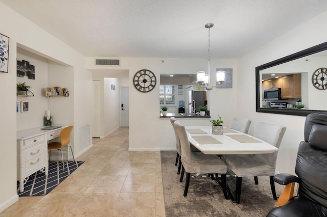 2070 Homewood Blvd Unit 1115, Delray Beach, FL 33445 - dining room with a desk, a chandelier, and baseboards