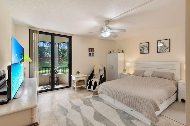 2070 Homewood Blvd Unit 1115, Delray Beach, FL 33445 - bedroom with access to exterior, light tile patterned floors, a textured ceiling, and ceiling fan