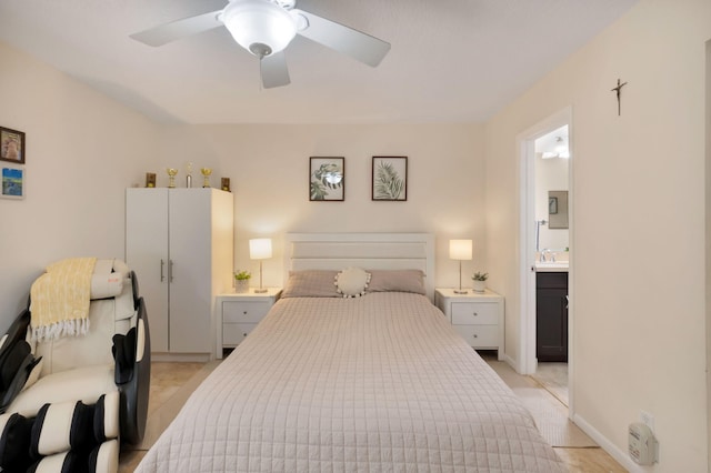2070 Homewood Blvd Unit 1115, Delray Beach, FL 33445 - bedroom with a sink, ensuite bath, ceiling fan, and baseboards