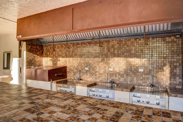 2070 Homewood Blvd Unit 1115, Delray Beach, FL 33445 - kitchen featuring a textured ceiling