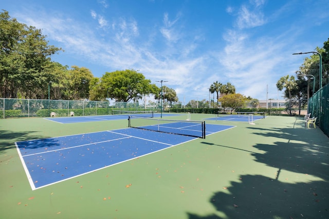2070 Homewood Blvd Unit 1115, Delray Beach, FL 33445 - view of tennis court featuring fence and community basketball court