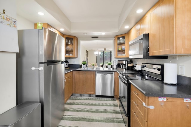 2070 Homewood Blvd Unit 1115, Delray Beach, FL 33445 - kitchen featuring appliances with stainless steel finishes, dark countertops, glass insert cabinets, recessed lighting, and a sink