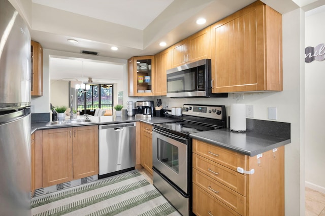2070 Homewood Blvd Unit 1115, Delray Beach, FL 33445 - kitchen with appliances with stainless steel finishes, a sink, recessed lighting, dark countertops, and glass insert cabinets