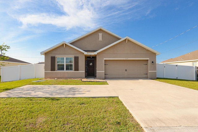567 SW Paar Dr, Port Saint Lucie, FL 34953 - view of front of property with stucco siding, an attached garage, driveway, and a gate