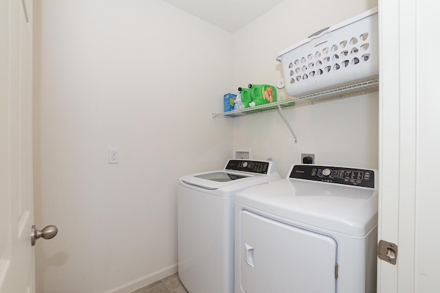 567 SW Paar Dr, Port Saint Lucie, FL 34953 - clothes washing area with independent washer and dryer and baseboards