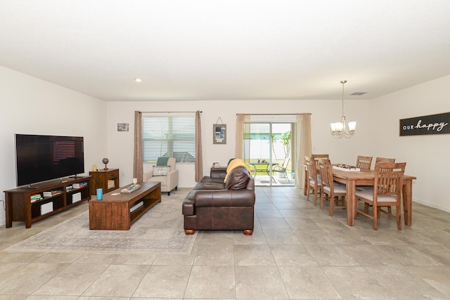 567 SW Paar Dr, Port Saint Lucie, FL 34953 - living area with a chandelier, light tile patterned floors, and recessed lighting