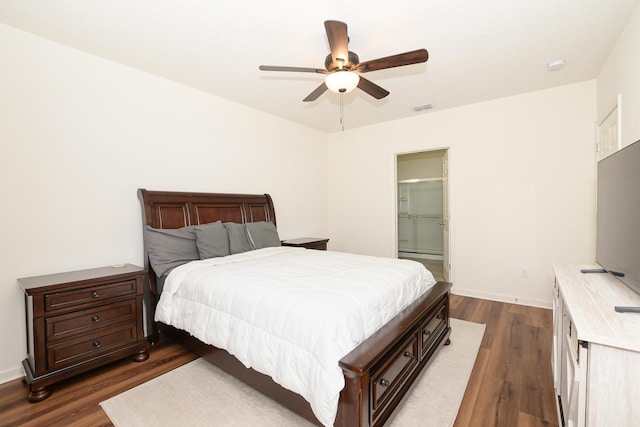 567 SW Paar Dr, Port Saint Lucie, FL 34953 - bedroom with dark wood finished floors, a ceiling fan, and baseboards