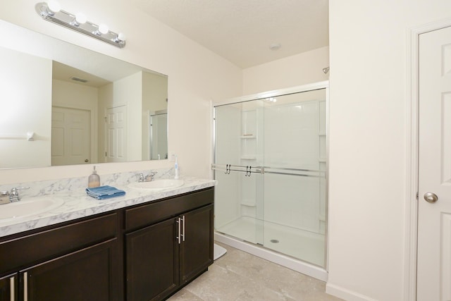 567 SW Paar Dr, Port Saint Lucie, FL 34953 - full bathroom featuring a shower stall, double vanity, and tile patterned flooring