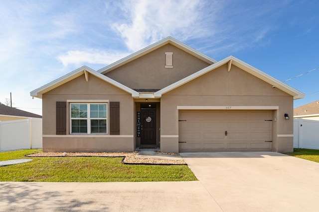 567 SW Paar Dr, Port Saint Lucie, FL 34953 - view of front facade with stucco siding, a garage, and driveway