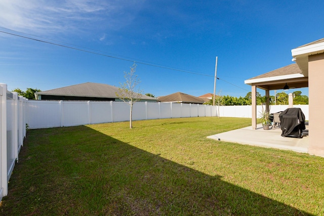 567 SW Paar Dr, Port Saint Lucie, FL 34953 - view of yard with a patio area