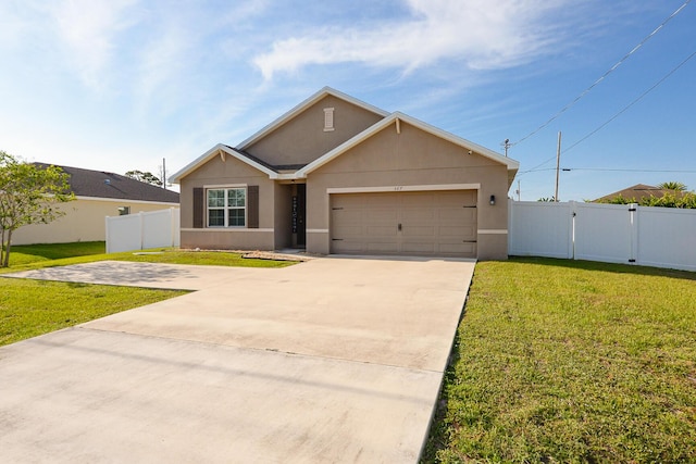 567 SW Paar Dr, Port Saint Lucie, FL 34953 - view of front of house with stucco siding, driveway, an attached garage, and a gate