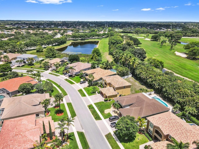 aerial view of residential area with a large body of water and a golf club
