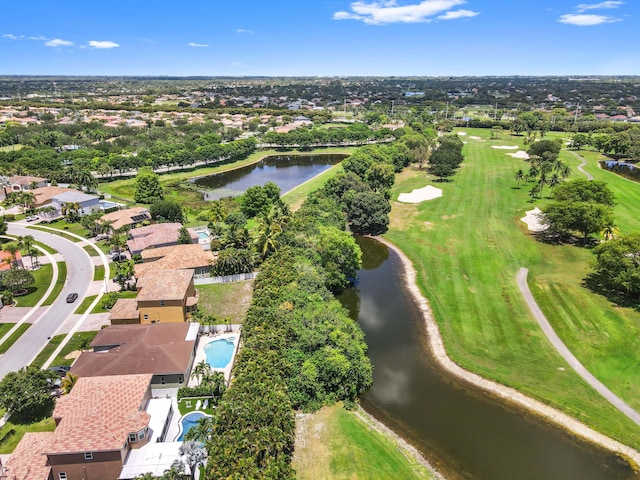 aerial overview of property's location with a large body of water, a golf course, and nearby suburban area