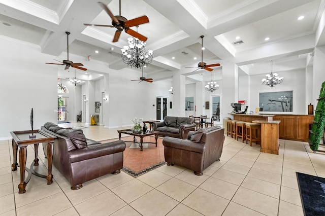 living area featuring a chandelier, a ceiling fan, light tile patterned floors, coffered ceiling, and beam ceiling