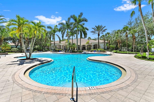 community pool featuring a patio area