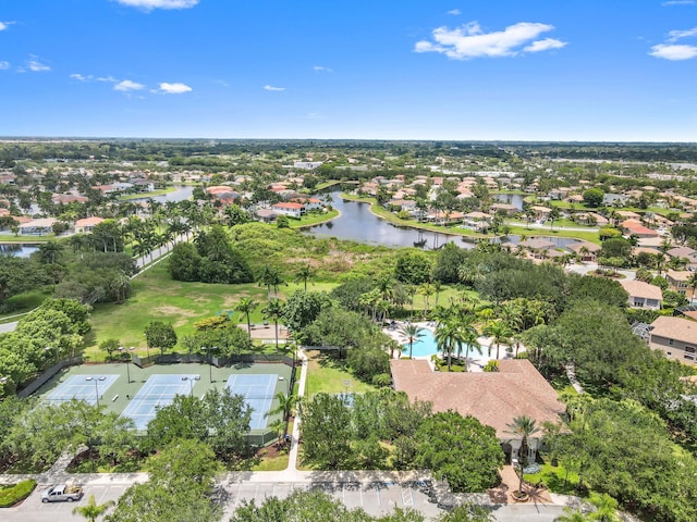 view of property location with a nearby body of water and nearby suburban area