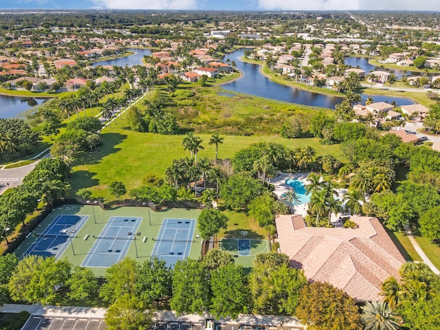 aerial perspective of suburban area with a large body of water