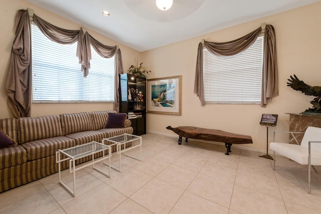 living area with tile patterned flooring and baseboards
