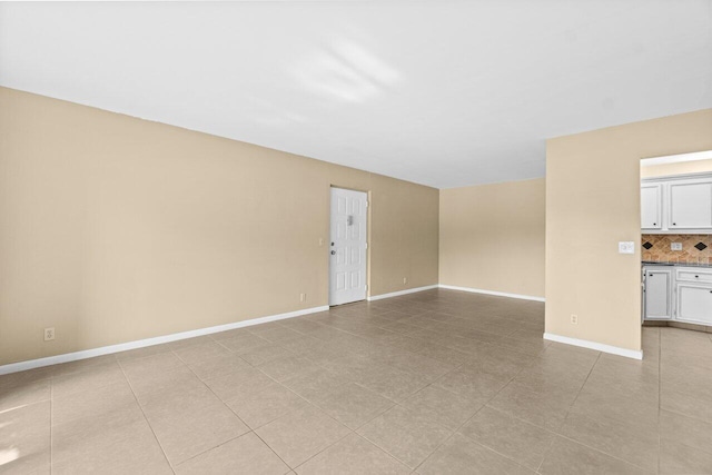 629 Sea Pine Way Unit D1, Greenacres, FL 33415 - unfurnished living room with baseboards and light tile patterned floors