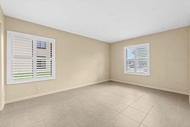 629 Sea Pine Way Unit D1, Greenacres, FL 33415 - empty room with baseboards and tile patterned floors