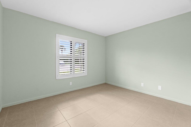 629 Sea Pine Way Unit D1, Greenacres, FL 33415 - empty room featuring baseboards and light tile patterned floors