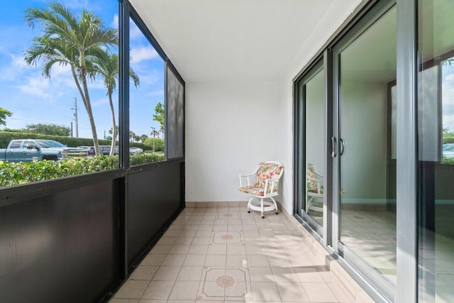 629 Sea Pine Way Unit D1, Greenacres, FL 33415 - sunroom featuring tile patterned floors and baseboards