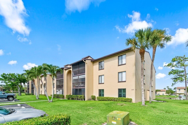 629 Sea Pine Way Unit D1, Greenacres, FL 33415 - view of building exterior featuring uncovered parking