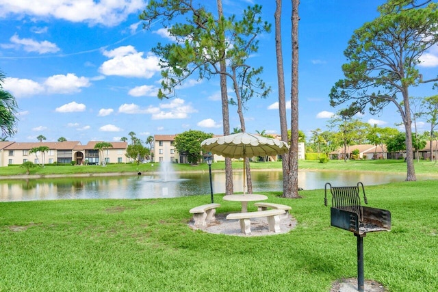 629 Sea Pine Way Unit D1, Greenacres, FL 33415 - view of property's community with a water view, a yard, and a residential view