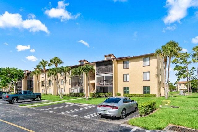 629 Sea Pine Way Unit D1, Greenacres, FL 33415 - view of building exterior featuring uncovered parking