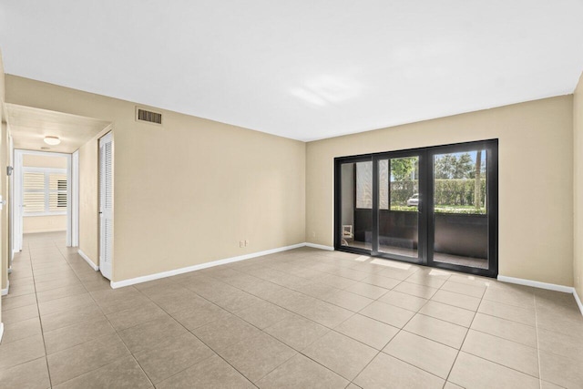 629 Sea Pine Way Unit D1, Greenacres, FL 33415 - spare room featuring light tile patterned floors and baseboards