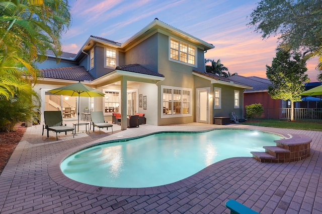 127 Via Castilla, Jupiter, FL 33458 - rear view of property with a patio area, stucco siding, and a tiled roof