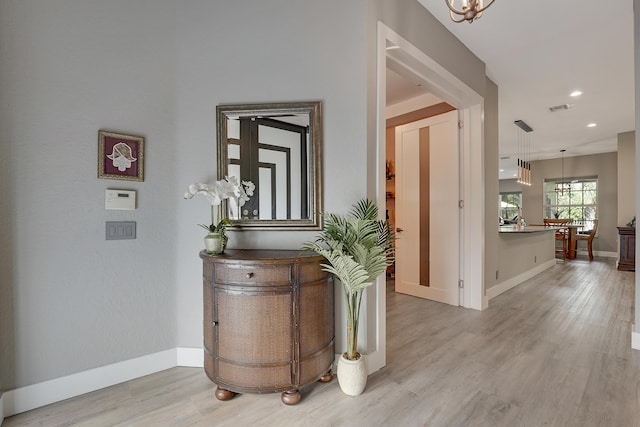 127 Via Castilla, Jupiter, FL 33458 - corridor featuring baseboards, light wood finished floors, a chandelier, and recessed lighting