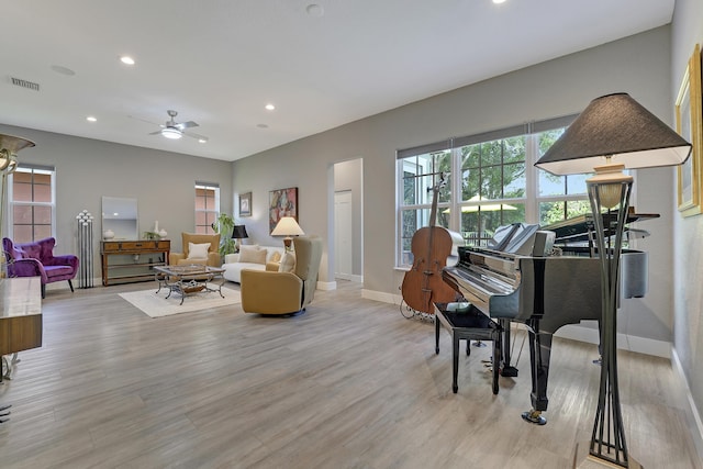127 Via Castilla, Jupiter, FL 33458 - living room featuring baseboards, healthy amount of natural light, recessed lighting, and light wood finished floors