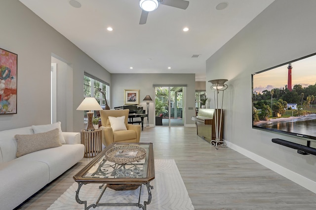 127 Via Castilla, Jupiter, FL 33458 - living area with light wood-type flooring, recessed lighting, baseboards, and ceiling fan