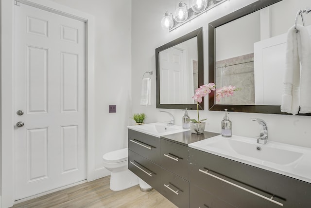127 Via Castilla, Jupiter, FL 33458 - full bath featuring double vanity, wood finished floors, and tiled shower