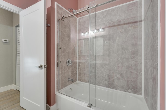 127 Via Castilla, Jupiter, FL 33458 - bathroom with combined bath / shower with glass door, baseboards, and wood finished floors