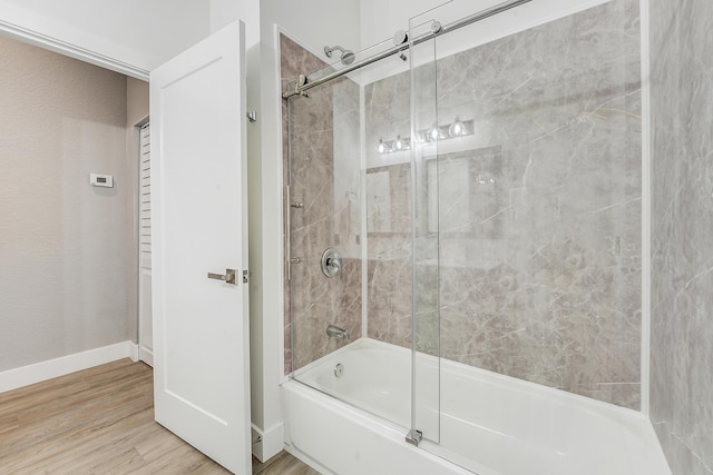 127 Via Castilla, Jupiter, FL 33458 - full bath with bath / shower combo with glass door and wood finished floors
