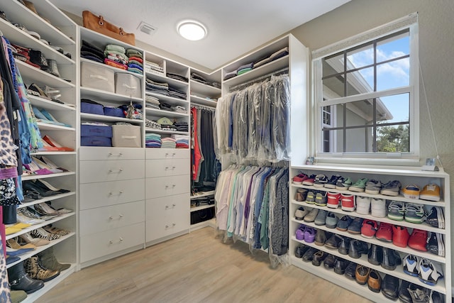 127 Via Castilla, Jupiter, FL 33458 - walk in closet featuring wood finished floors