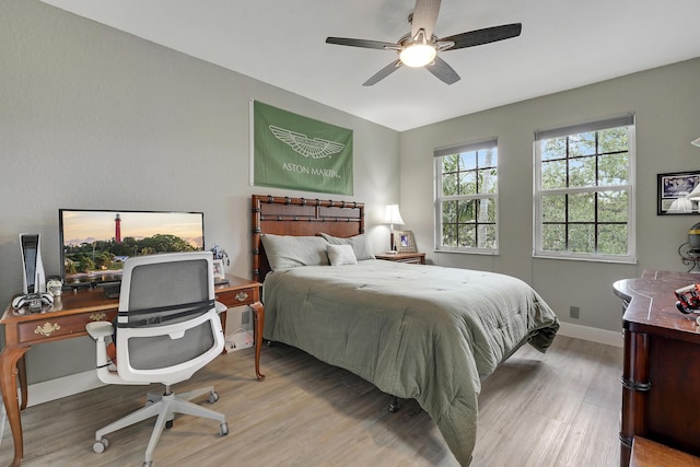 127 Via Castilla, Jupiter, FL 33458 - bedroom with wood finished floors, baseboards, a desk, and ceiling fan