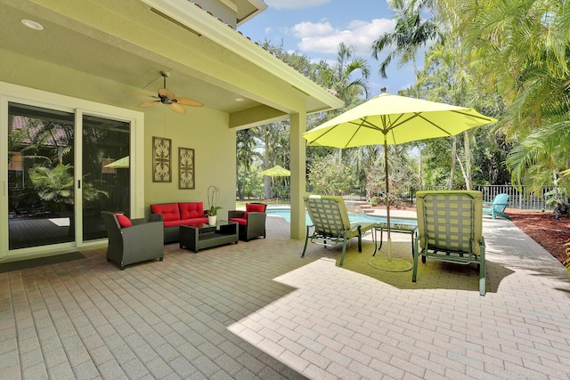 127 Via Castilla, Jupiter, FL 33458 - view of patio with an outdoor hangout area, ceiling fan, and an outdoor pool