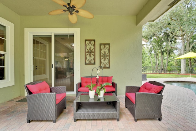 127 Via Castilla, Jupiter, FL 33458 - view of patio / terrace featuring ceiling fan, an outdoor living space, and an outdoor pool