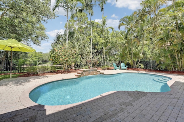 127 Via Castilla, Jupiter, FL 33458 - view of swimming pool with a patio