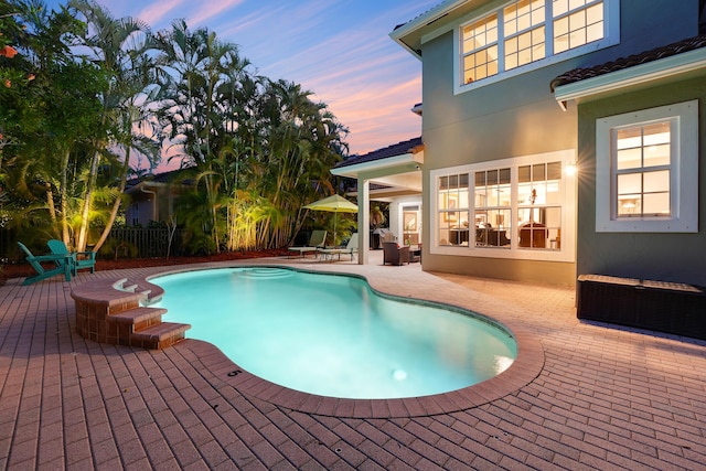 127 Via Castilla, Jupiter, FL 33458 - swimming pool featuring a patio