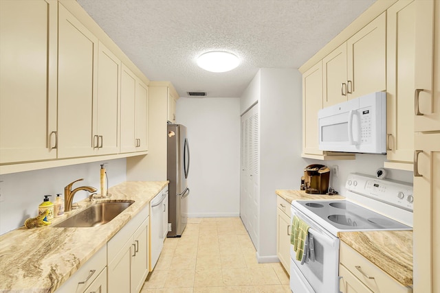 3477 Christopher St Unit 3477, West Palm Beach, FL 33417 - kitchen with white appliances, a textured ceiling, light stone counters, and light tile patterned flooring